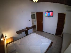 TV a/nebo společenská místnost v ubytování Pousada Casa Do Angelo