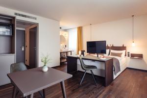 Televizors / izklaižu centrs naktsmītnē Boutique Hotel das TSCHOFEN Appartements