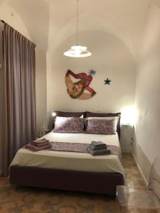 A bed or beds in a room at MaGiA