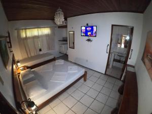 Postel nebo postele na pokoji v ubytování Pousada Casa Do Angelo
