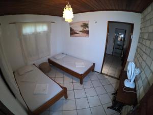 Postel nebo postele na pokoji v ubytování Pousada Casa Do Angelo