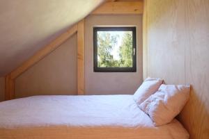 Voodi või voodid majutusasutuse Chalet d'Orti toas