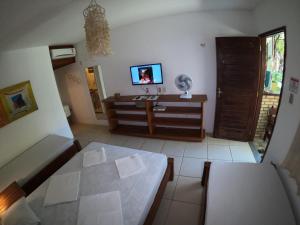 Postel nebo postele na pokoji v ubytování Pousada Casa Do Angelo
