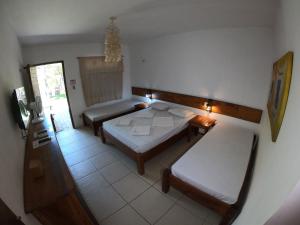 Postel nebo postele na pokoji v ubytování Pousada Casa Do Angelo