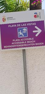 a sign for a beach with a sign for a sign at PLAYA LAS VISTAS LOFT in Los Cristianos