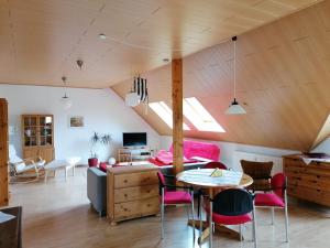 a living room with a couch and a table at Ferienwohnung Suedbalkon in Friesenheim