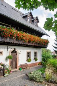 a house with a bunch of flowers on it at Kovárna in Nová Paka