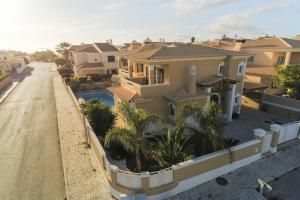 arial view of a house on a street with houses at D09 - Porto de Mós Luxury Villa in Lagos