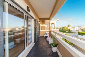 a balcony with a view of the ocean at D09 - Porto de Mós Luxury Villa in Lagos