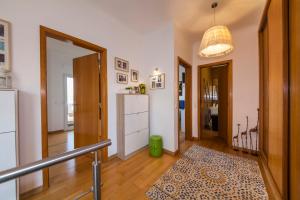 a room with a hallway with a refrigerator at D09 - Porto de Mós Luxury Villa in Lagos