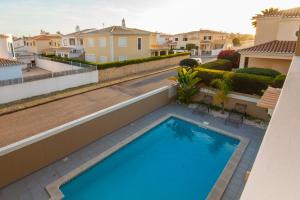 a swimming pool on the balcony of a house at D09 - Porto de Mós Luxury Villa in Lagos