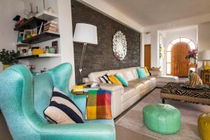 a living room with a couch and a chair at D09 - Porto de Mós Luxury Villa in Lagos