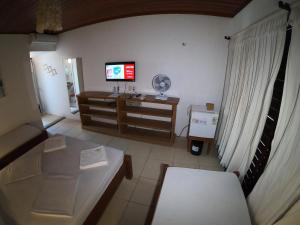 Postel nebo postele na pokoji v ubytování Pousada Casa Do Angelo