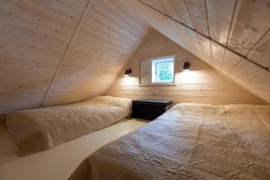 Postel nebo postele na pokoji v ubytování Beach Cottage - Nõuni Yacht Club