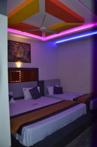 Postel nebo postele na pokoji v ubytování HOTEL PANCHAVARNAA