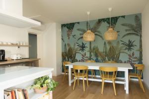 a kitchen with a white table and chairs at Da Coco - Rooms in Padova