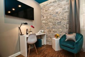 Posedenie v ubytovaní Riva Luxury Rooms