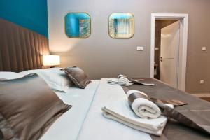 Posteľ alebo postele v izbe v ubytovaní Riva Luxury Rooms
