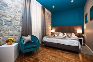 Posteľ alebo postele v izbe v ubytovaní Riva Luxury Rooms