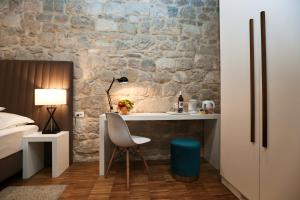 Posteľ alebo postele v izbe v ubytovaní Riva Luxury Rooms