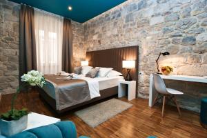 Posteľ alebo postele v izbe v ubytovaní Riva Luxury Rooms