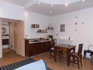 A kitchen or kitchenette at La Residenza Napoli Chiaia short let Apartment Superior Via Chiaia 82
