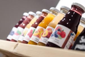 a row of bottles of juice in a box at AGRITURISMO La Giasena in Ponte nellʼAlpi