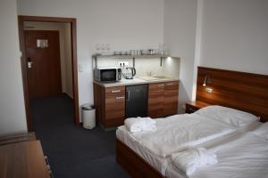 Postel nebo postele na pokoji v ubytování Lipno Wellness - Frymburk C 401