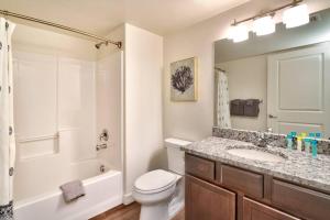 a bathroom with a toilet and a sink and a shower at 6B Cozy Moab RedCliff Condo, Pool & Hot Tub in Moab