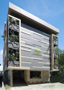 a building with a sign on the side of it at Zoot Kochi Infopark in Cochin