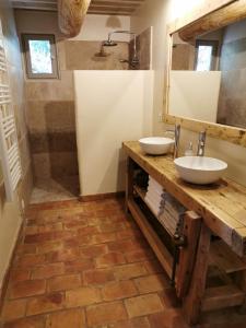 a bathroom with two sinks and a mirror at Les anes de petit jean in Pierrefeu-du-Var +24 photos