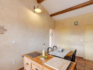 a dining room with a table and a table and chairs at Heritage Villa in Les Mages with Swimming Pool in Les Mages