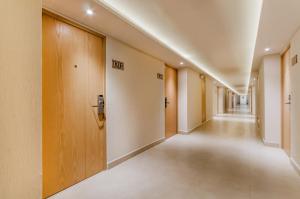an empty corridor of a hospital hallway with wooden doors at Royal Solaris Cancun-All Inclusive in Cancún