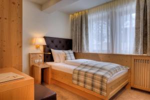 Postel nebo postele na pokoji v ubytování Hotel Palin