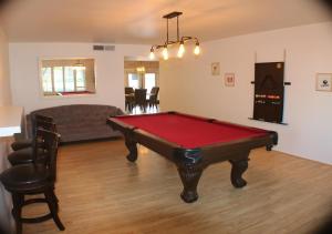 a living room with a pool table and a couch at Modern Cottage Style in Tempe
