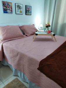 מיטה או מיטות בחדר ב-Vila Mulungu