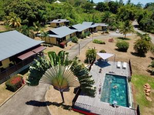 an aerial view of a resort with a swimming pool at Lodges Balourou in Montjoly