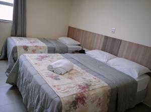 Ein Bett oder Betten in einem Zimmer der Unterkunft Hotel Biton
