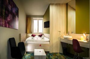 Postel nebo postele na pokoji v ubytování Kongres Hotel Roca