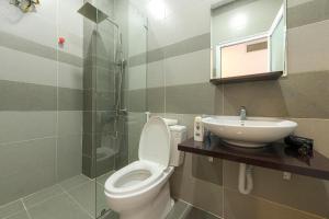 a bathroom with a toilet and a sink at The Green House Da Lat in Da Lat +53 photos