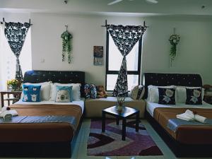 Postelja oz. postelje v sobi nastanitve D'Gunduls Homestay STUDIO by DGH I-CITY