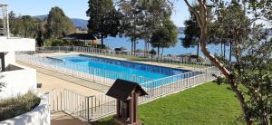 a swimming pool with a fence around it at La Puntilla in Villarrica