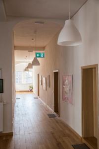 an empty hallway in a building with a sign on the wall at Pension Schloss Heringen in Heringen