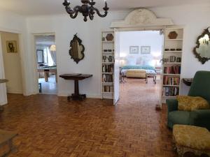 a living room with a couch and a table at Beacon Vlei Guest farm in Balgowan