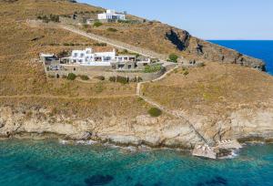 an aerial view of a house on a cliff at BluEros Luxury Villa - Syros Private Pool Gem in Megas Gialos - Nites
