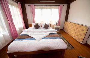 Postel nebo postele na pokoji v ubytování Heritage Home Dhulikhel