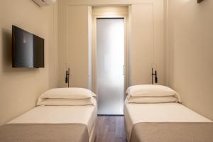 Postel nebo postele na pokoji v ubytování Hotel Smeraldo