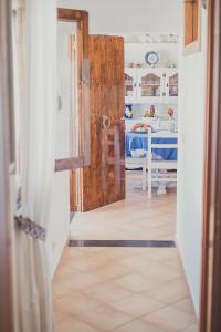 an open door to a room with a bedroom at The Garden on Capri in Massa Lubrense