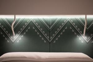 Postel nebo postele na pokoji v ubytování DOMU' MONTEGRAPPA 54