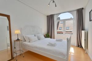Un pat sau paturi într-o cameră la Villa Olga